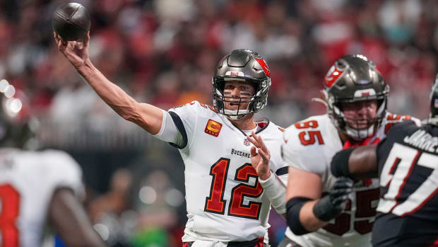 Tom Brady throws a pass against the Falcons during a game in 2021
